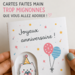 Idées de cartes d'anniversaire DIY présentées sur une table avec des fournitures créatives.