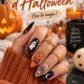 Des ongles décorés pour Halloween avec des motifs de citrouilles et de fantômes en couleurs vives.