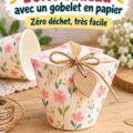 Une boîte cadeau colorée fabriquée à partir d'un gobelet en papier, sur une table festive.