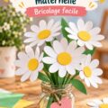 Marguerites en papier colorées sur une table, symbole d'amour maternel.