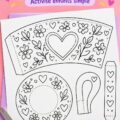 Tasse en papier colorée réalisée pour la fête des mères, sur fond décoratif.